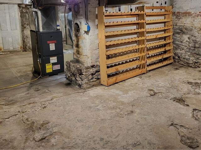 Wet Basement Waterproofed With Interior Drainage and Sump Pump in Little Chute, WI - Before Photo