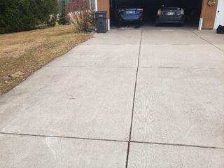 Concrete Driveway Settling Repaired & Sealed In Marathon, WI