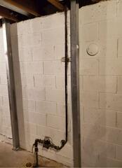 Bowing Block Wall Foundation Supported & Stabilized With PowerBraces In Kewaskum, WI