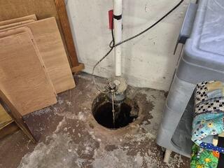 Wet Basement Repaired with Sump Pump Installation in Medford, WI