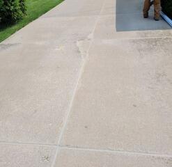 Cracked, Sloping Concrete Driveway Causing Foundation Water Issues Fixed in Mount Calvary, WI