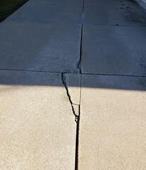 Cracked, Sloping Concrete Driveway Causing Foundation Water Issues Fixed in Mount Calvary, WI