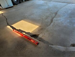 Cracked, Sunken Garage Floor Lifted and Leveled in Plainfield, WI