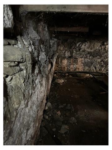 Stabilizing Rocky Basement Wall in Newport, ME - Before Photo