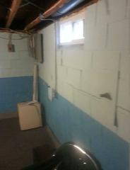 Bowing and Cracking Foundation Repaired with PowerBrace in Bunker Hill, IL Basement
