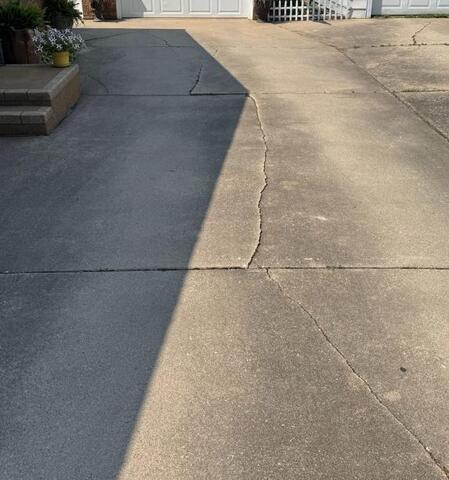 Uneven Driveway Leveled in Mason City, IA - Before Photo