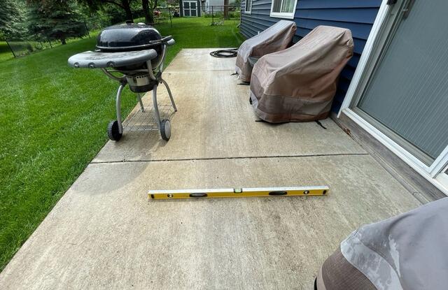 Uneven Porch Lifted in Dundas, MN - Before Photo