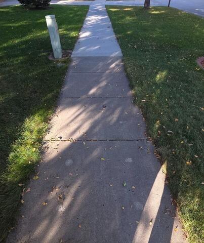 Uneven Concrete Sidewalk Leveled in Grand Forks, ND