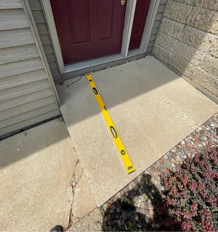 Sinking Front Step Lifted in Saint Charles, MN - Before Photo