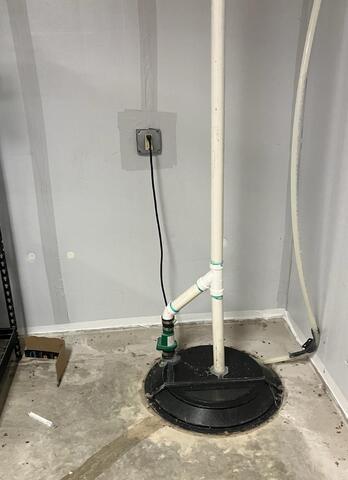 Out-Of-Date Sump Pump Replaced in New Hampton, IA - Before Photo