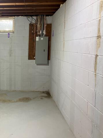 Leaking Basement Floor Waterproofed in Eagan, MN - Before Photo