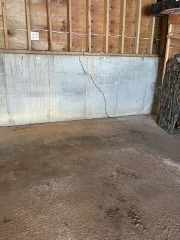 Buckling Garage Foundation Repair in Winona, MN - Before Photo