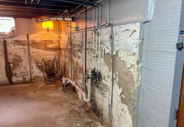 Mason City, IA, Basement Waterproofed and Repaired - Before Photo
