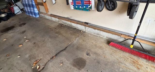 Sinking Garage Floor Lifted in Minnetonka, MN - Before Photo
