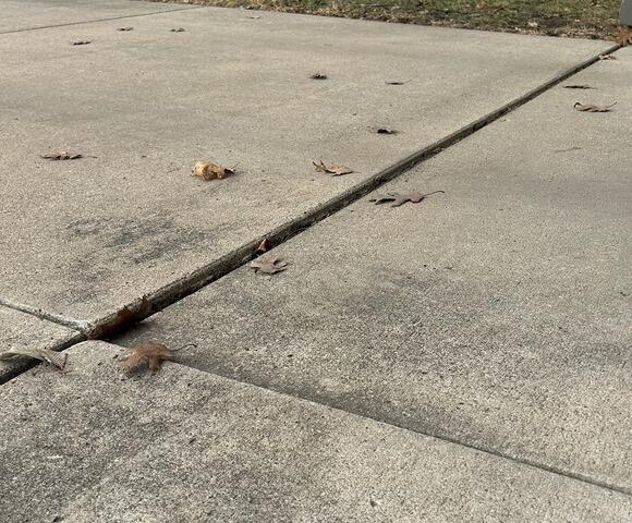 Sinking Driveway Gets a Lift in Mankato, MN - Before Photo