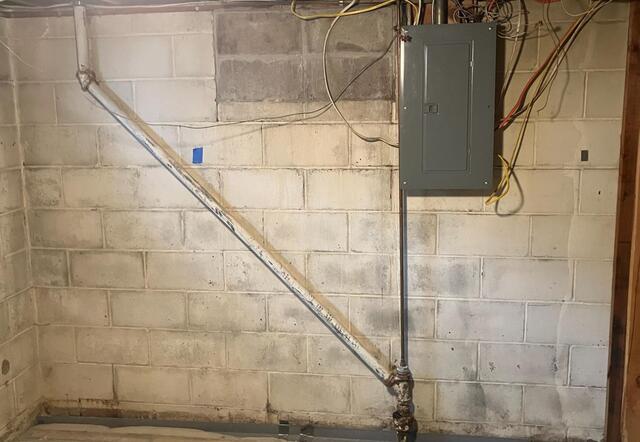 Basement Waterproofing and Foundation Repair Completed in Waukon, IA - Before Photo