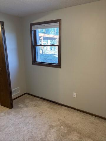 Damp Basement Floor Waterproofed in Woodbury, MN - Before Photo
