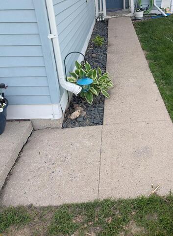 Sunken Concrete Walkway Leveled in Wahpeton, ND - Before Photo