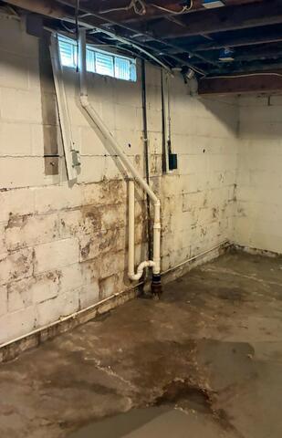 Charles City, IA, Basement Repaired and Waterproofed - Before Photo
