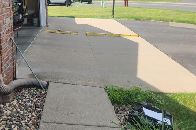 Driveway and Walkway Leveling in Hudson, WI - Before Photo