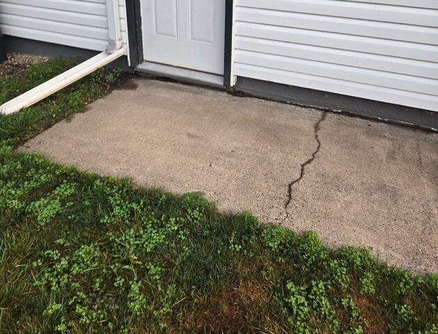 Sinking Slab Leveling in Eau Claire, WI - Before Photo