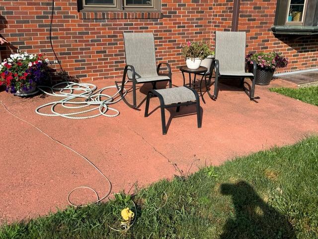 Concrete Patio Lifting in Chippewa Falls, WI - Before Photo