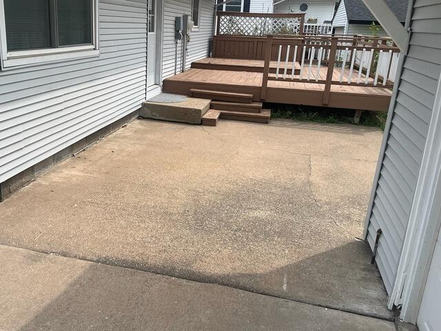 Sinking Concrete Patio Repair in Onalaska, WI - Before Photo