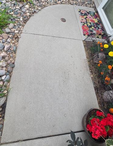 Sinking Concrete Walkway Lifted in Grand Forks, ND - Before Photo