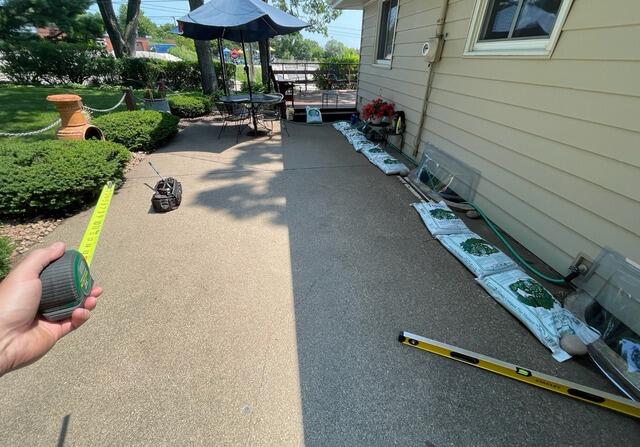 Minnetonka, MN Concrete Patio Lifting and Repair - Before Photo