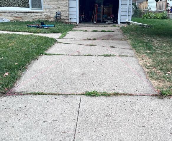 Concrete Driveway Sink Repair in Minneapolis, MN - Before Photo