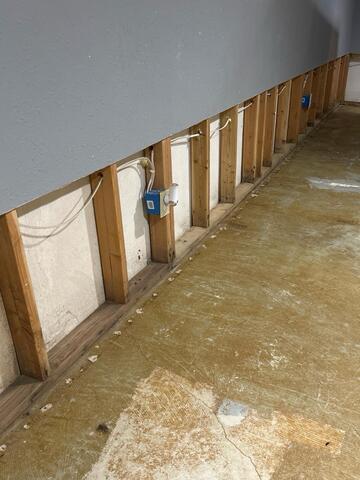 Professional Basement Waterproofing in Osage, IA - Before Photo