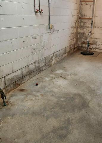 West Union, IA, Leaky Basement Waterproofed and Repaired - Before Photo