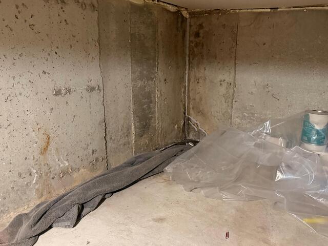 Leaking Basement Corner Waterproofed in West Fargo, ND - Before Photo