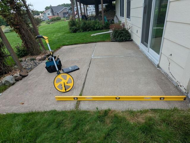Sloped Patio Leveling in St Paul, MN - Before Photo