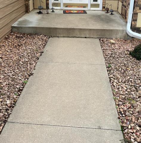 Concrete Leveling Company Repairs Sinking Step in Rochester, MN - Before Photo