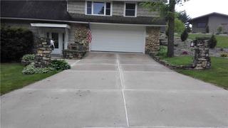 Uneven sidewalk and driveway in Sparta, WI.