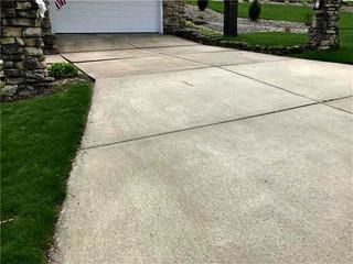 Uneven sidewalk and driveway in Sparta, WI.