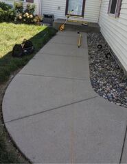 Uneven Walkway Lifted in River Falls, WI