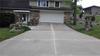 Uneven sidewalk and driveway in Sparta, WI.