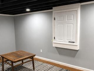 Basement Transformation with New Ceiling & Electrical Panel Concealment