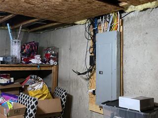Basement Transformation with New Ceiling & Electrical Panel Concealment