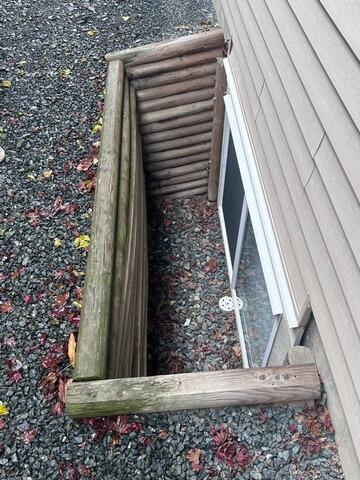 Multiple Window Well Replacement and Drainage Improvement in Chilliwack - Before Photo