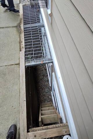 Rebuilding for Better Drainage Around the Basement Window - Before Photo