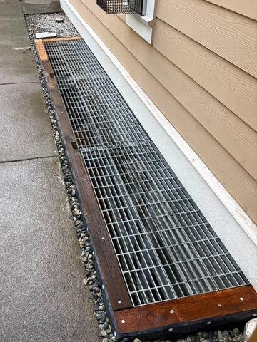 Rebuilding for Better Drainage Around the Basement Window - After Photo