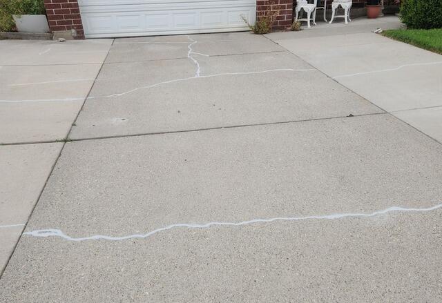 Concrete Driveway Repair in Taylorsville, Utah. Leveled with Polylevel and sealed with Nexuspro - After Photo