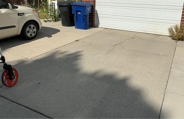 Concrete Driveway Repair in Taylorsville, Utah. Leveled with Polylevel and sealed with Nexuspro - Before Photo