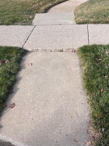 Concrete Sidewalk Lifting & Joint Sealing - Bountiful, UT - Before Photo