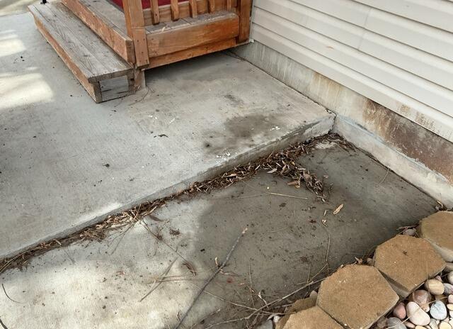 Concrete Lifting and NexusPro Joint Sealing Near Entryway in Ogden, UT - Before Photo