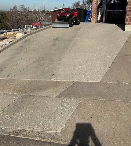 Concrete Driveway Leveling & Crack Repair in Farmington, UT - Before Photo