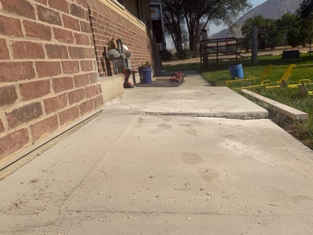 Sunken Concrete Walkway Repair in Logan, UT - Before Photo